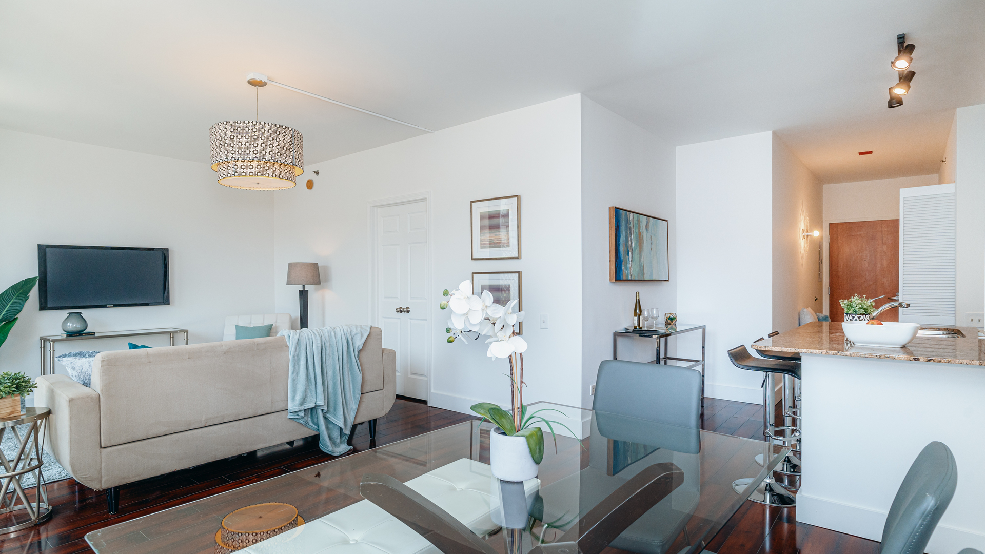 210 South Desplaines Street, Unit 606 Chicago, IL 60661 - Photo 11 of 33 a living room with furniture and a flat screen tv