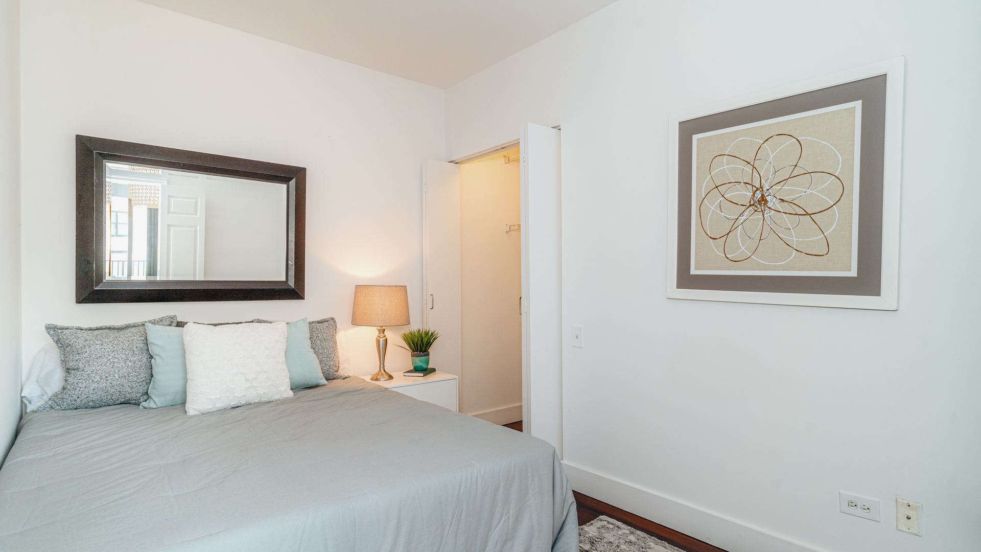 210 South Desplaines Street, Unit 606 Chicago, IL 60661 - Photo 16 of 33 a bedroom with a bed and window