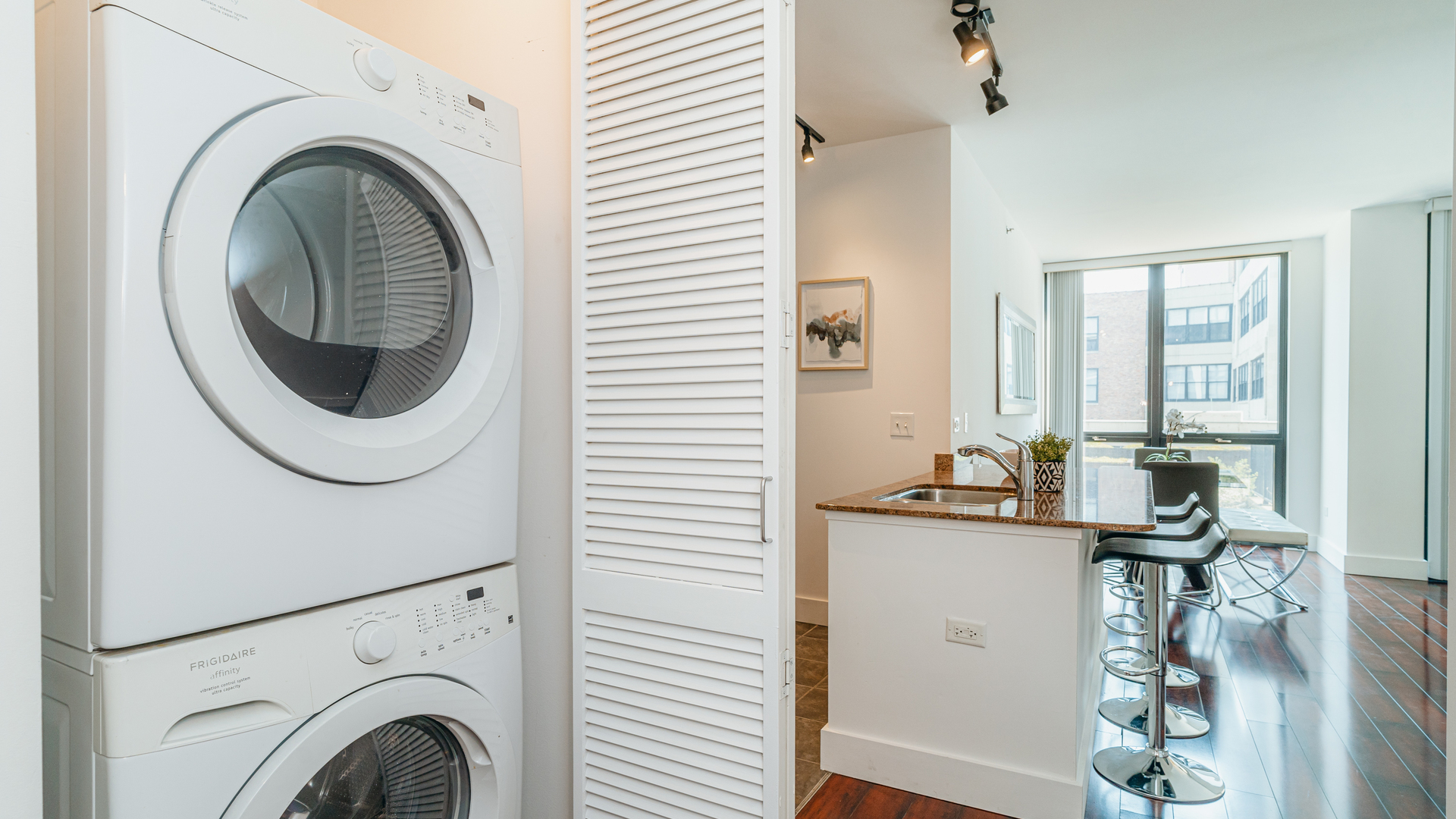 210 South Desplaines Street, Unit 606 Chicago, IL 60661 - Photo 21 of 33 a view of entryway with washer and dryer