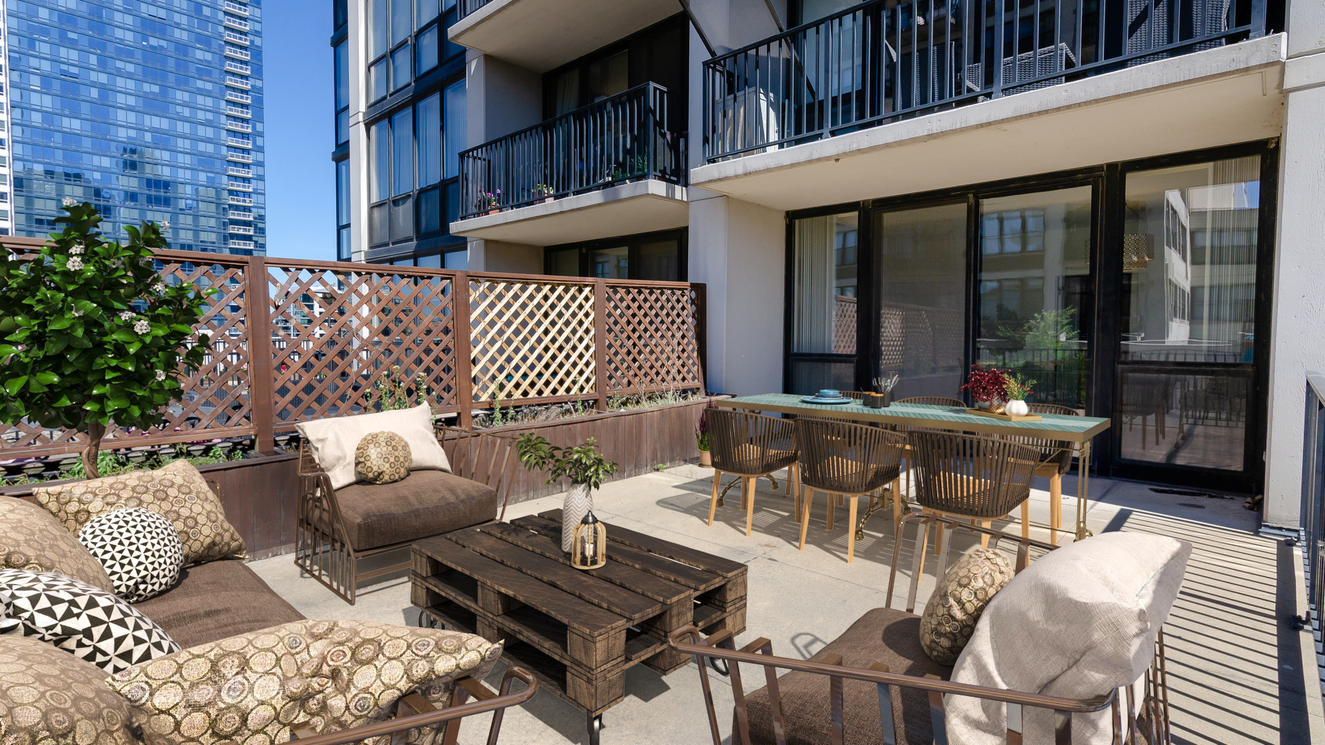 210 South Desplaines Street, Unit 606 Chicago, IL 60661 - Photo 26 of 33 a view of a patio with couches table and chairs and potted plants