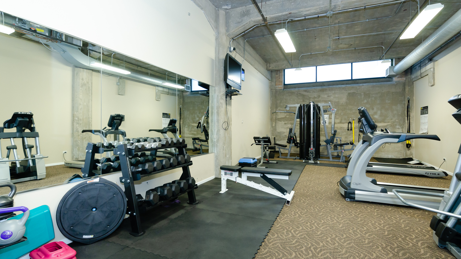 210 South Desplaines Street, Unit 606 Chicago, IL 60661 - Photo 28 of 33 a view of a room with gym equipment