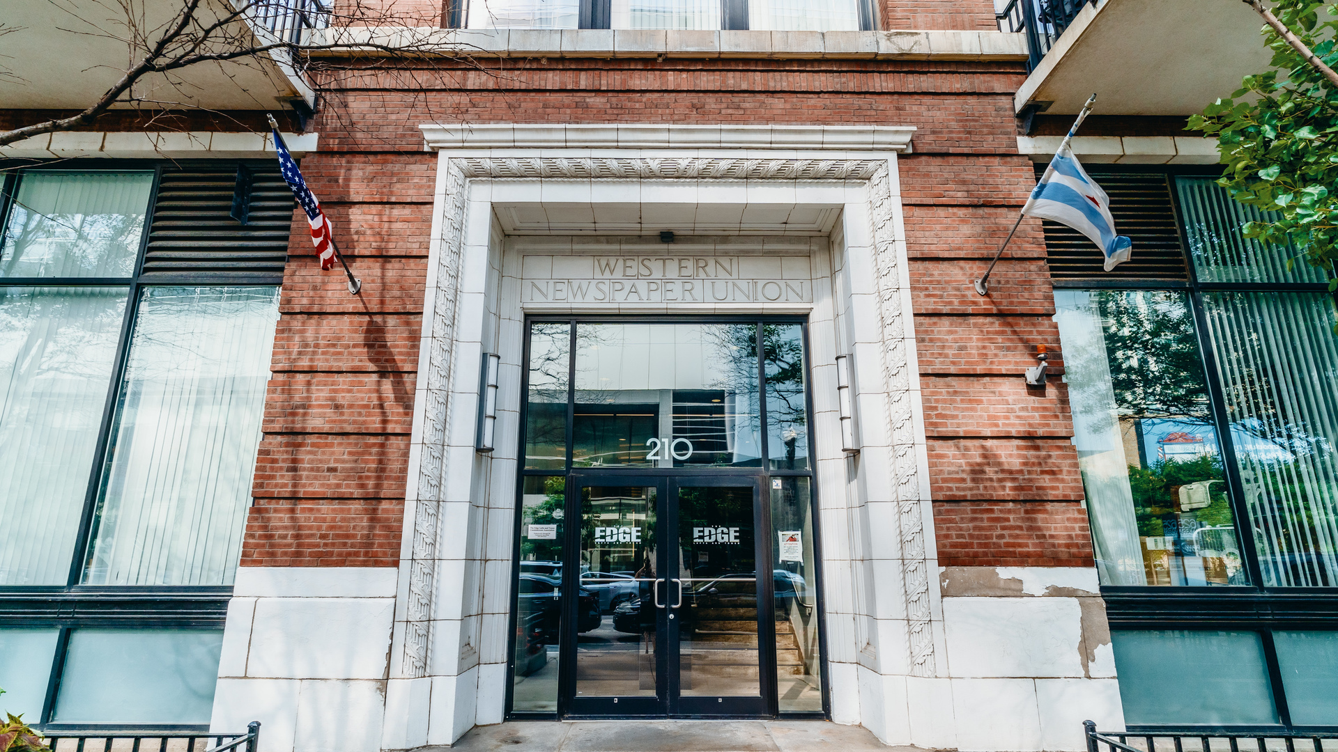 210 South Desplaines Street, Unit 606 Chicago, IL 60661 - Photo 4 of 33 a front view of a house with glass windows and door