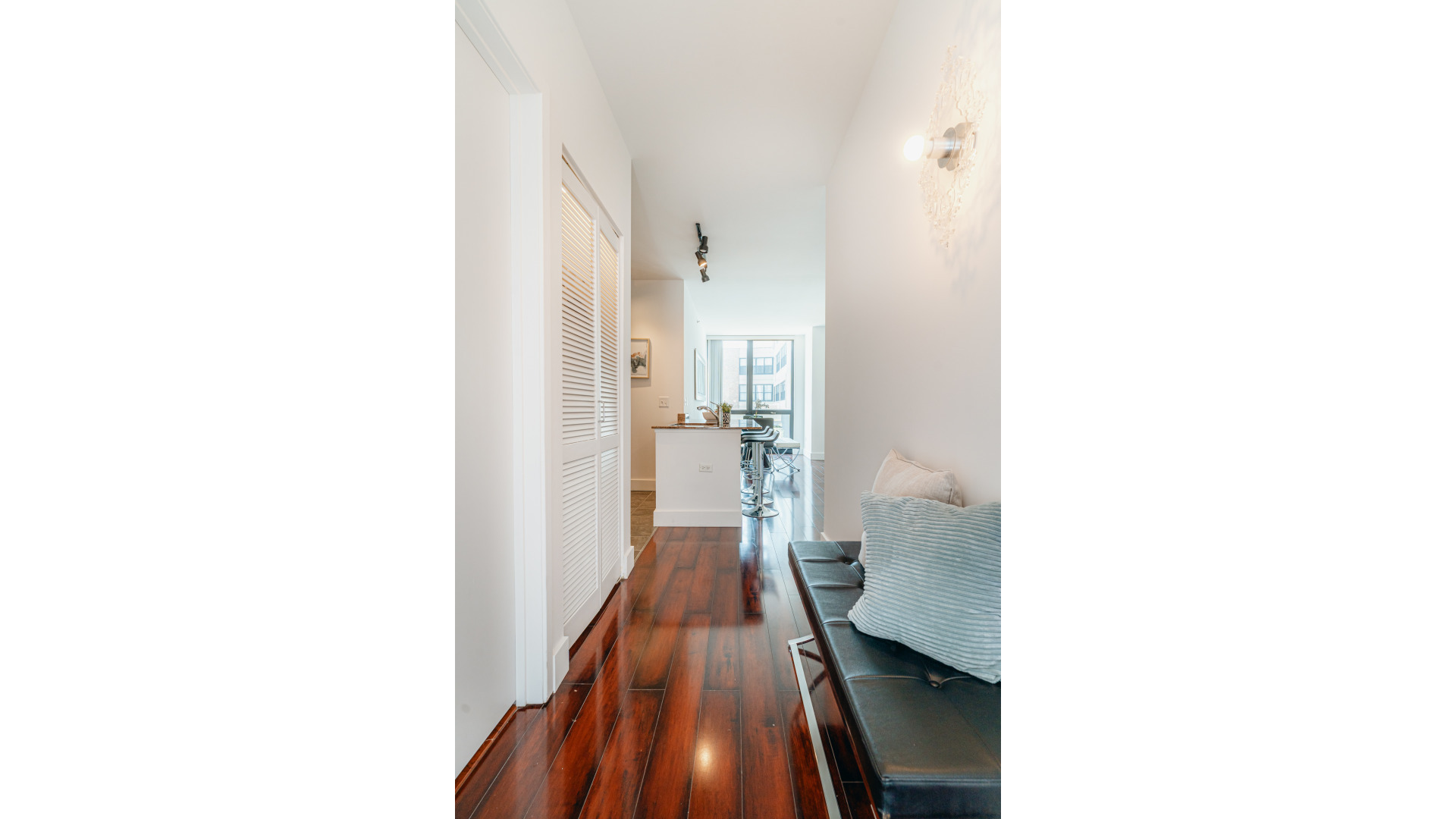 210 South Desplaines Street, Unit 606 Chicago, IL 60661 - Photo 5 of 33 a view of a hallway with a white walls