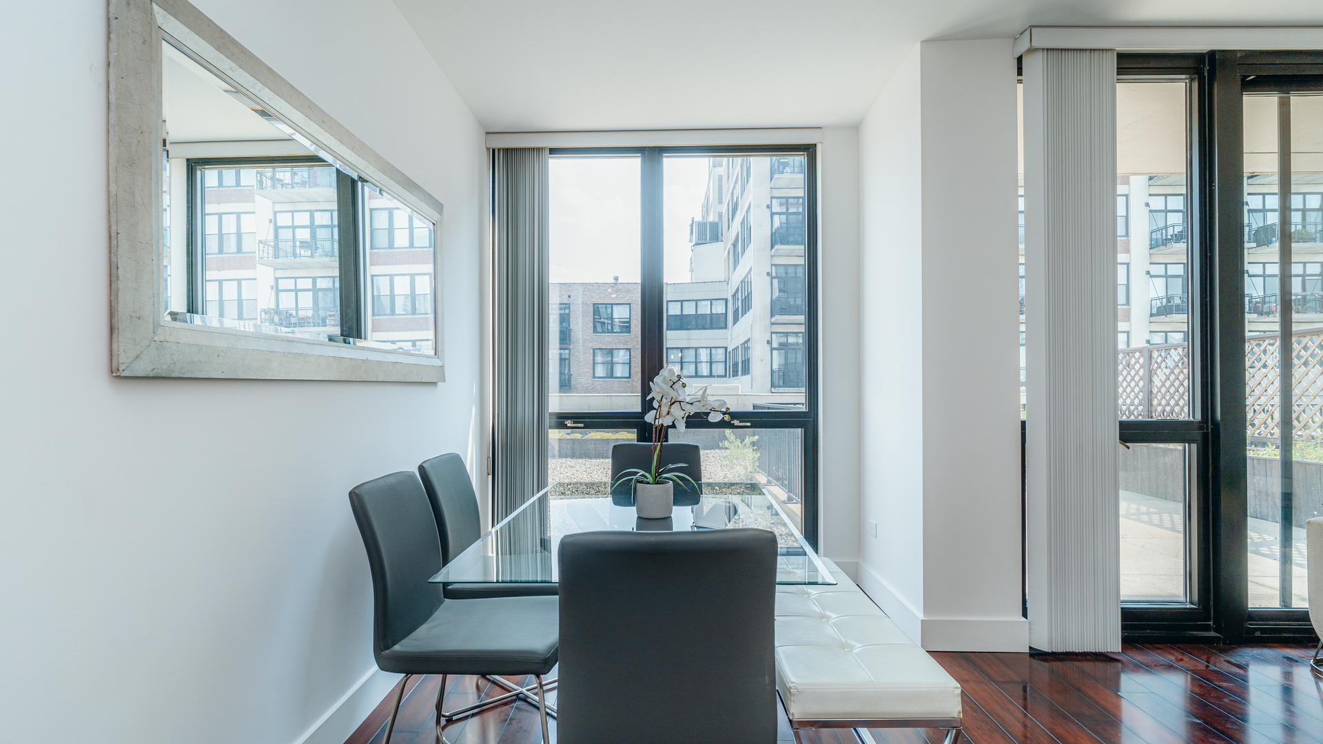 210 South Desplaines Street, Unit 606 Chicago, IL 60661 - Photo 10 of 33 a view of a dining room with furniture and wooden floor