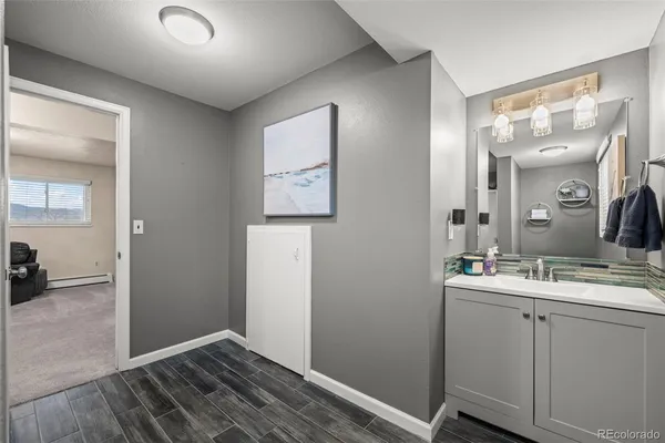 a bathroom with a sink and a mirror