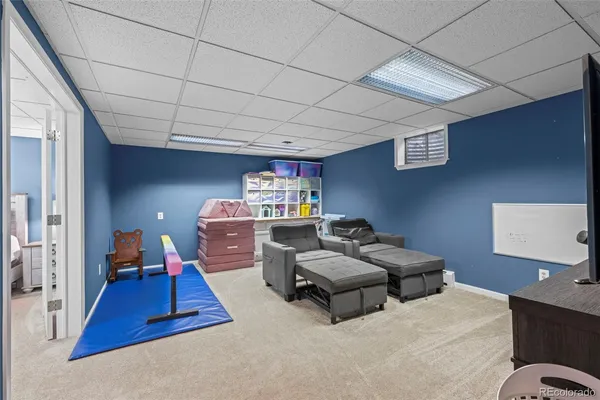 a bedroom with furniture and a wooden floor