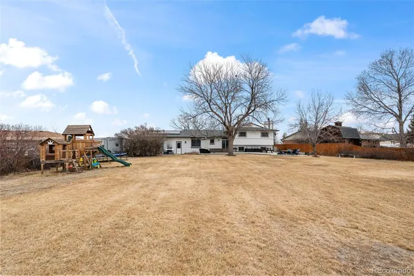 a view of a house with a snow on the road