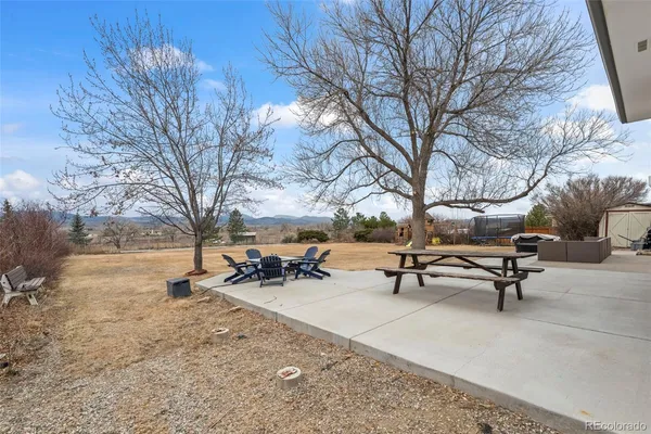 a bench and bench sitting in middle of snow