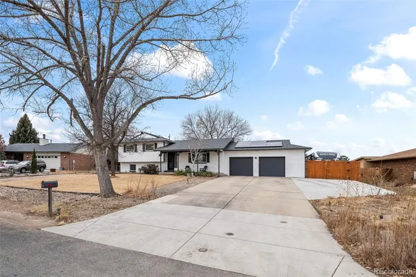 a view of a house with a snow in the yard