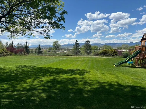 a view of a golf course with a lake