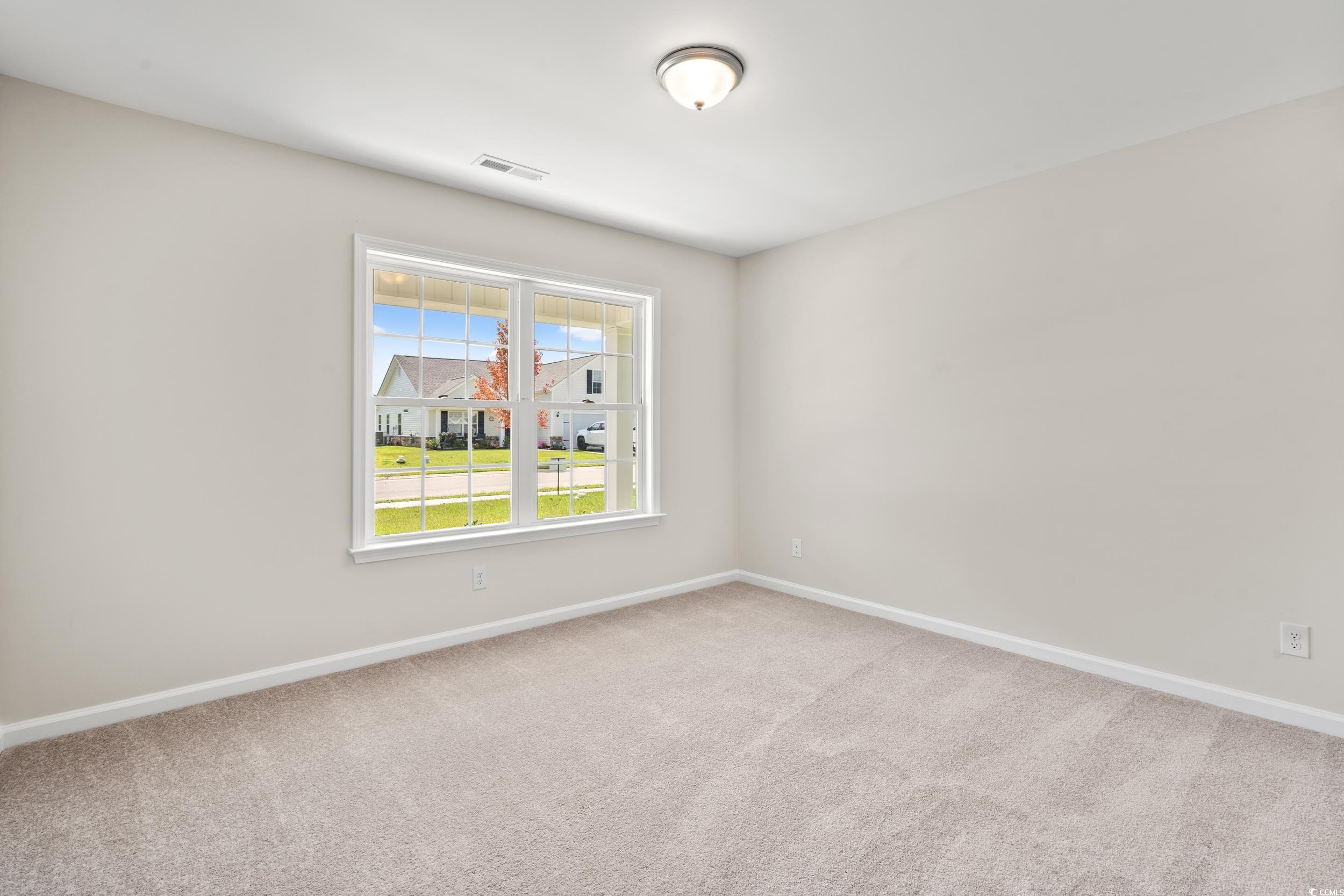 625 Woodside Drive Conway, SC 29526 - Photo 15 of 37 Empty room with carpet
