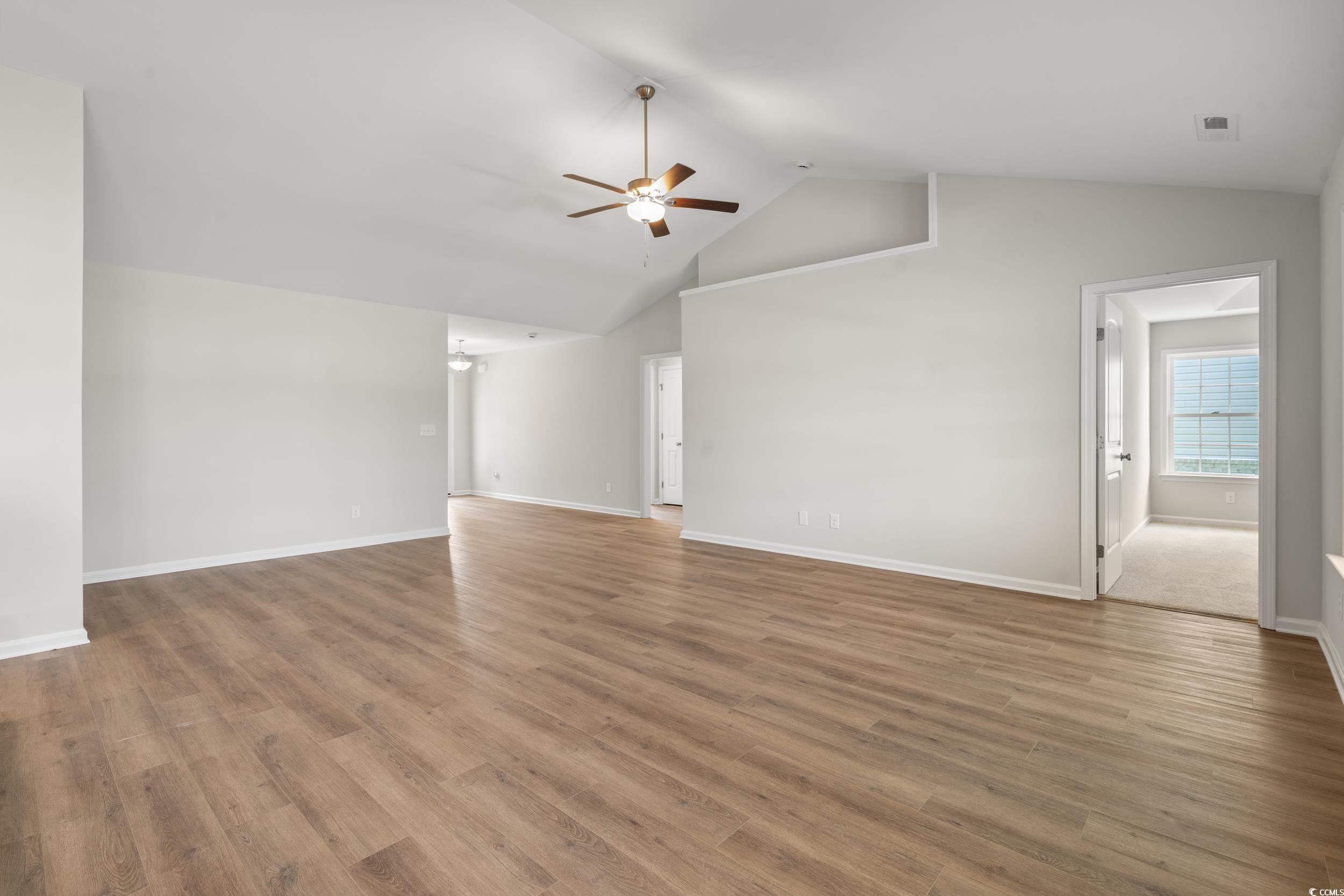 625 Woodside Drive Conway, SC 29526 - Photo 4 of 37 Unfurnished living room with ceiling fan, wood fin