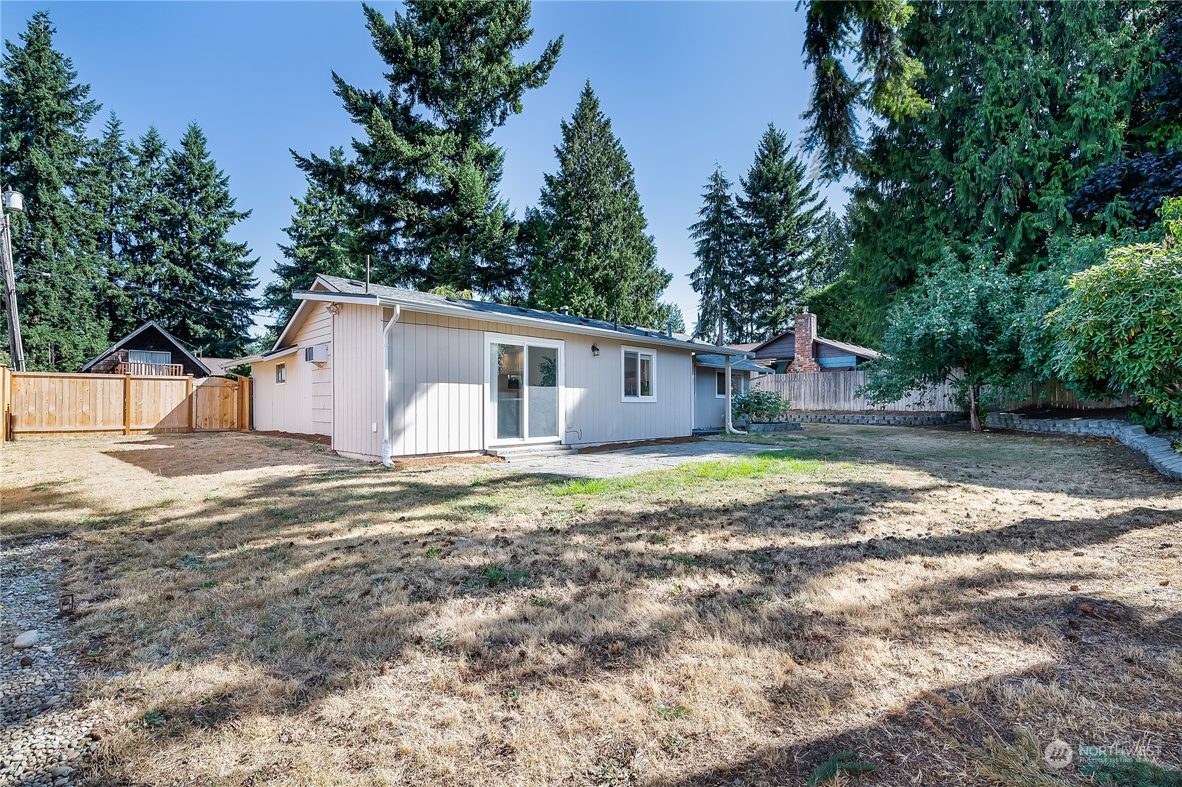 4007 Northeast 22nd Place Renton, WA 98056 - Photo 21 of 29 a view of a house with backyard and trees