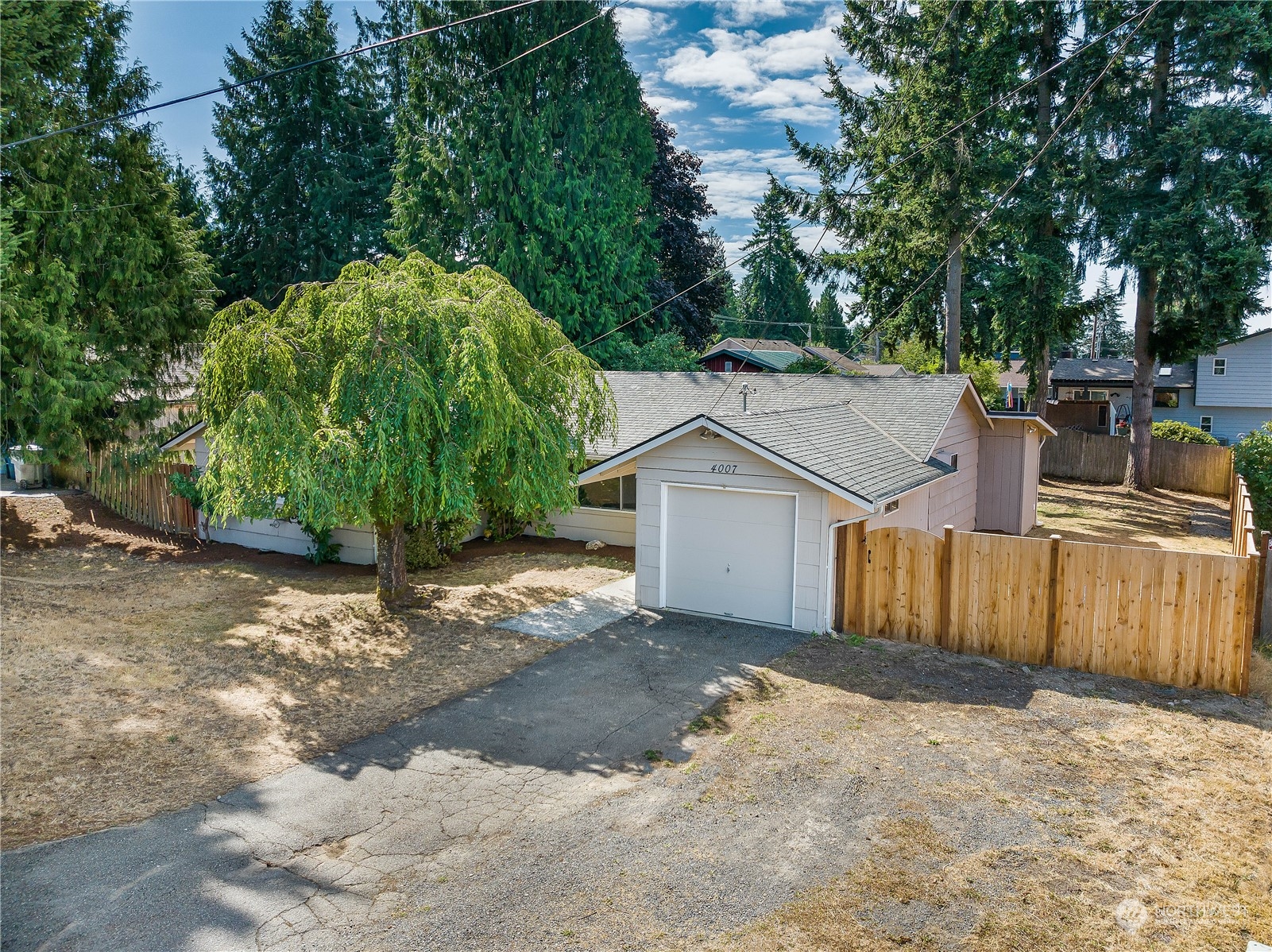 4007 Northeast 22nd Place Renton, WA 98056 - Photo 25 of 29 a view of a house with a yard