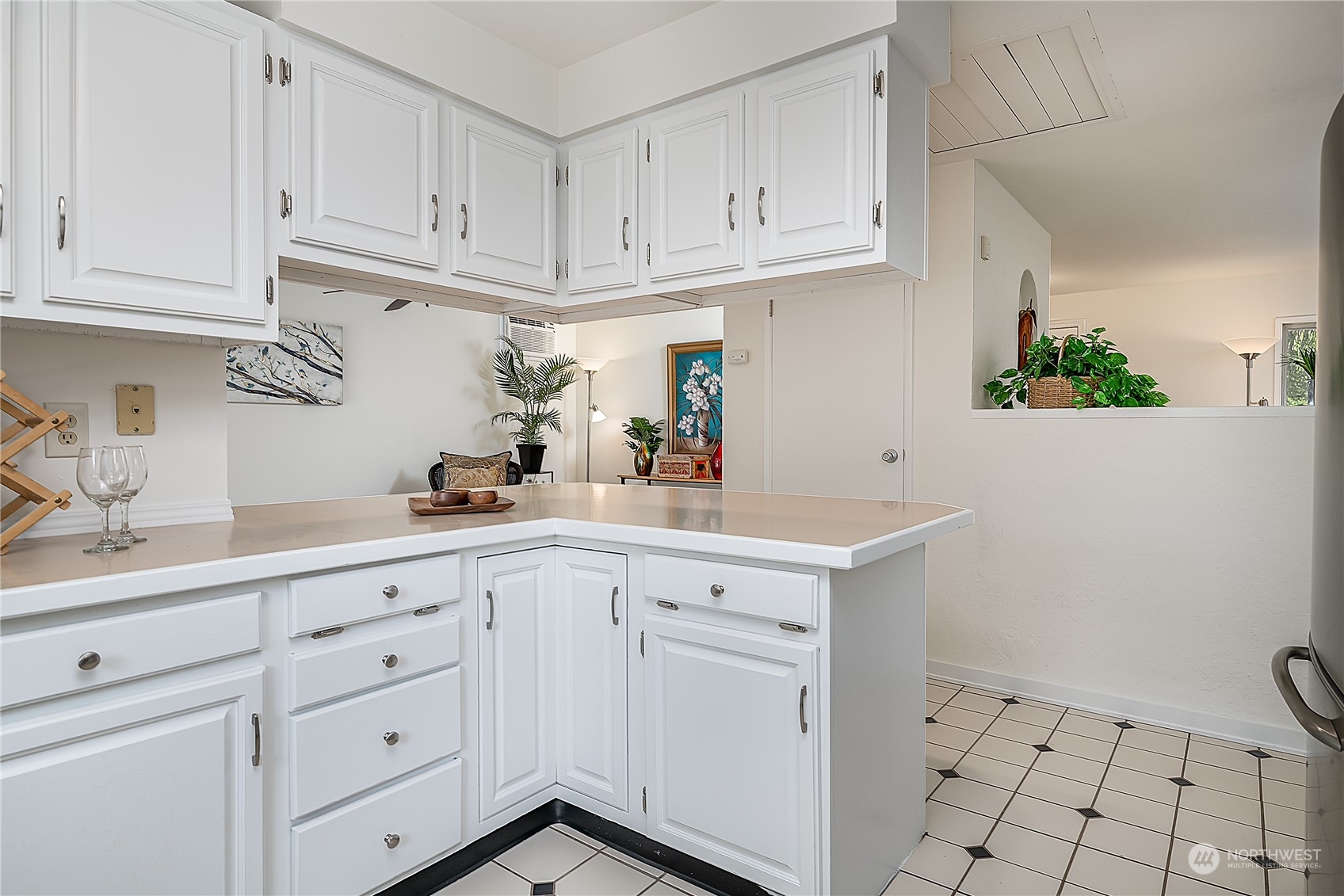4007 Northeast 22nd Place Renton, WA 98056 - Photo 9 of 29 a kitchen with white cabinets and white appliances