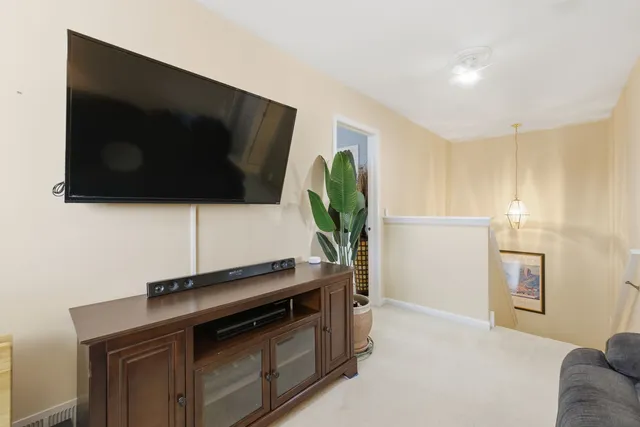 a kitchen with stainless steel appliances a stove microwave and refrigerator