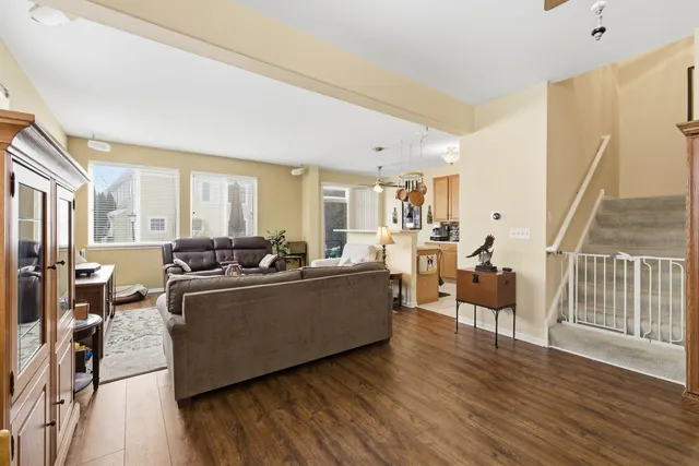a living room with furniture window and wooden floor