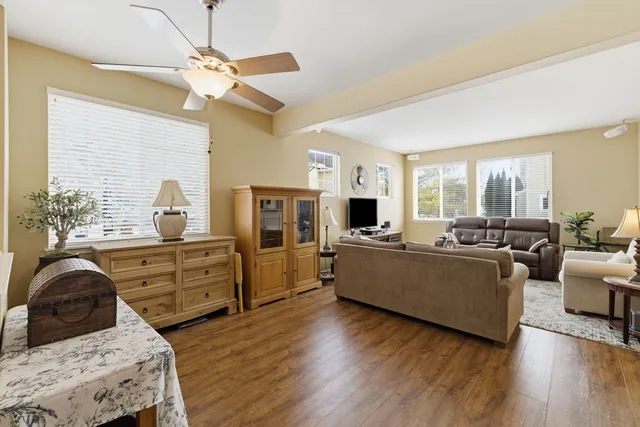 a living room with furniture and a large window