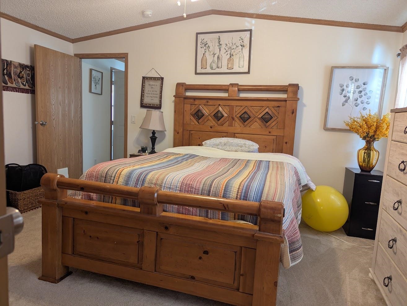 435 32 Road, Unit 628 Clifton, CO 81520 - Photo 21 of 31 a bedroom with a bed and cabinets