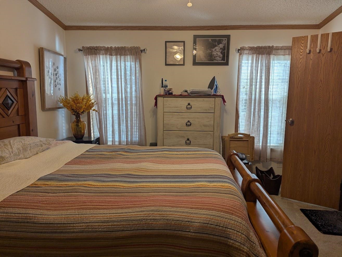 435 32 Road, Unit 628 Clifton, CO 81520 - Photo 25 of 31 a bedroom with a bed and a closet