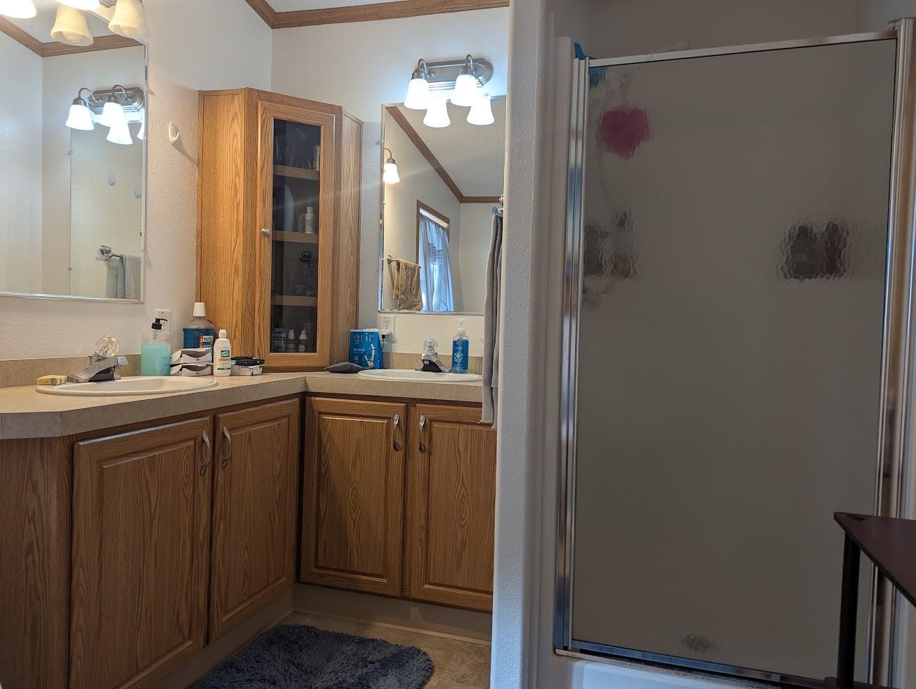 435 32 Road, Unit 628 Clifton, CO 81520 - Photo 26 of 31 a bathroom with a sink and a mirror