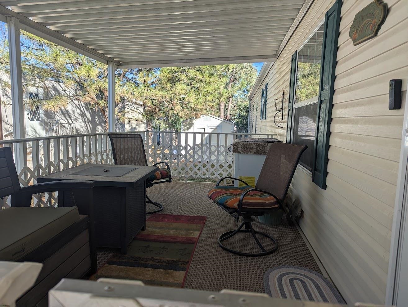 435 32 Road, Unit 628 Clifton, CO 81520 - Photo 28 of 31 a view of a porch with furniture and a yard