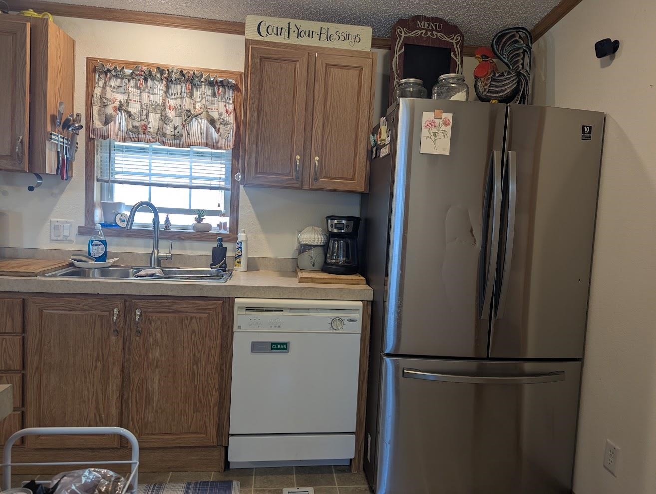 435 32 Road, Unit 628 Clifton, CO 81520 - Photo 4 of 31 a kitchen with stainless steel appliances granite countertop a refrigerator and a sink