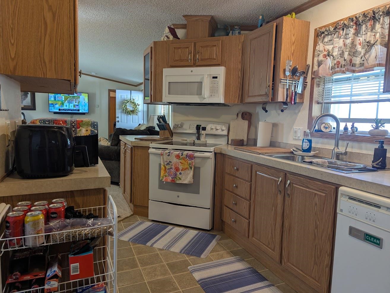 435 32 Road, Unit 628 Clifton, CO 81520 - Photo 5 of 31 a kitchen with stainless steel appliances a stove a sink and cabinets