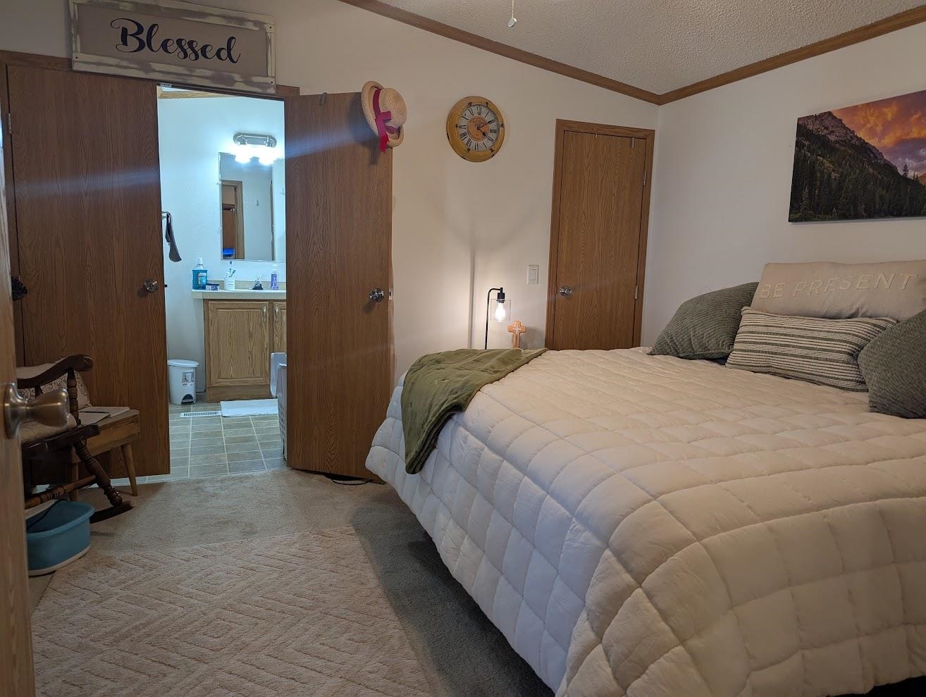 435 32 Road, Unit 628 Clifton, CO 81520 - Photo 8 of 31 a bedroom with a bed and a flat screen tv