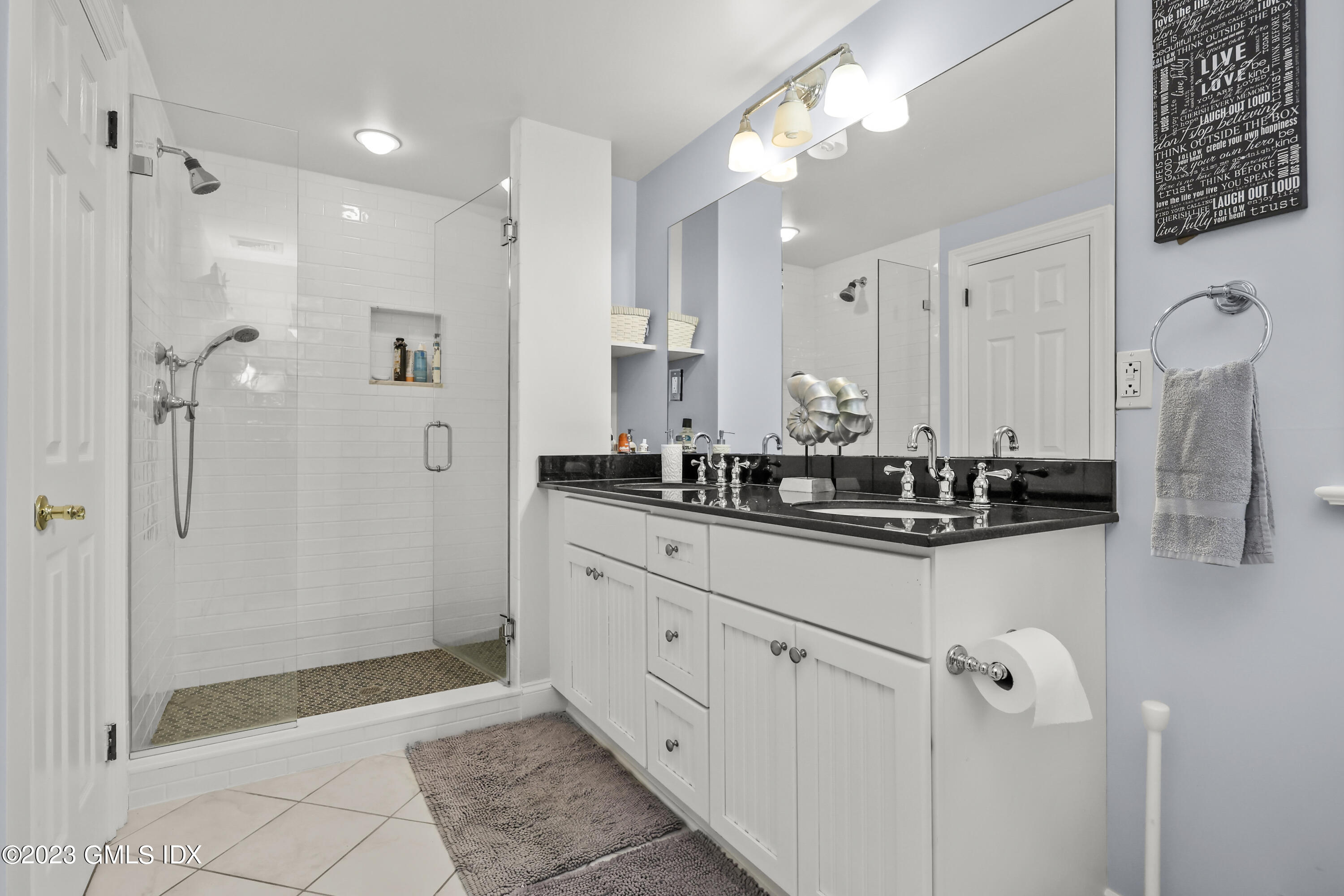 14 Rainbow Drive Riverside, CT 06878 - Photo 21 of 29 a bathroom with a double vanity sink mirror and shower