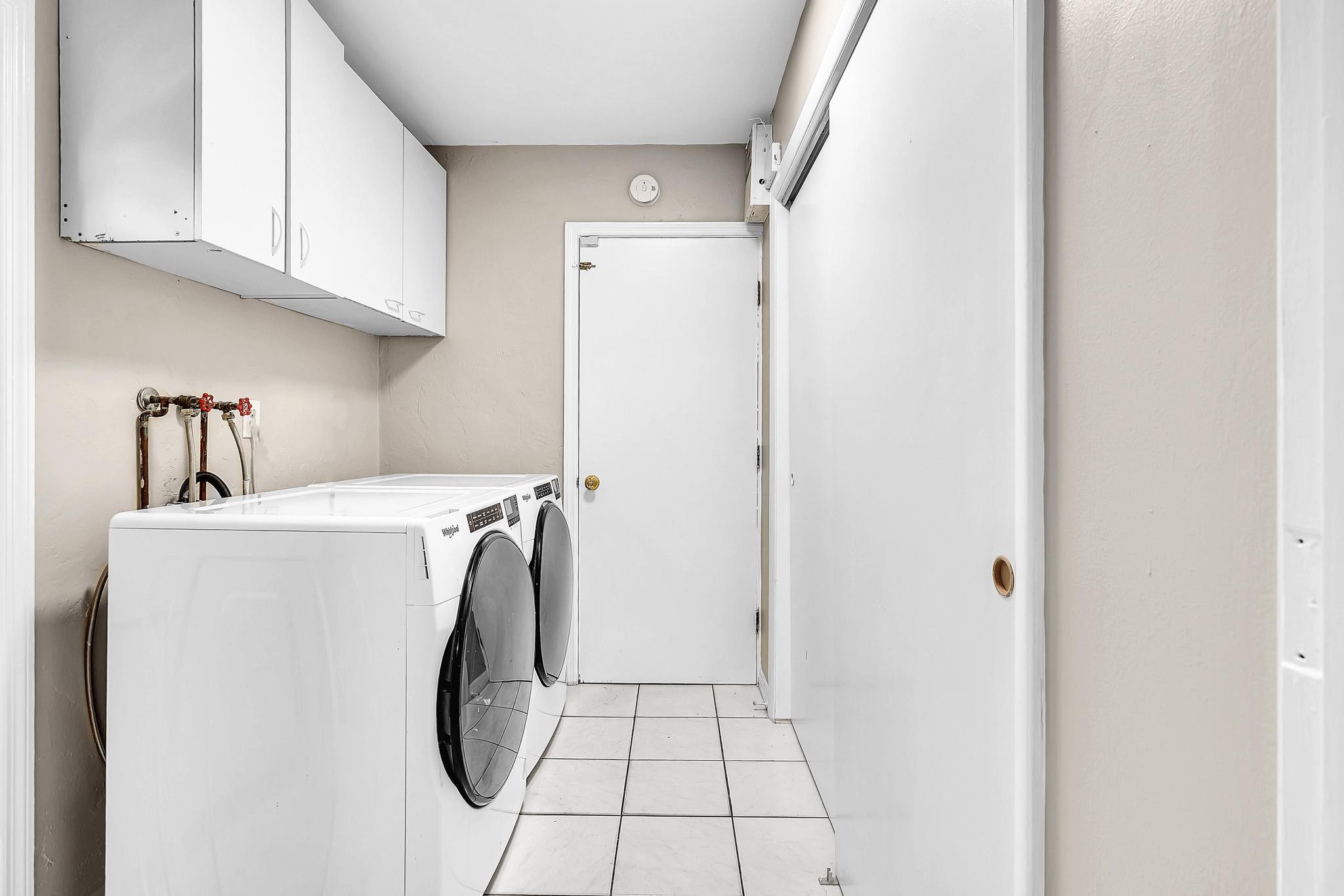 6144 Royal Lytham Drive Boca Raton, FL 33433 - Photo 26 of 70 a utility room with dryer and washer