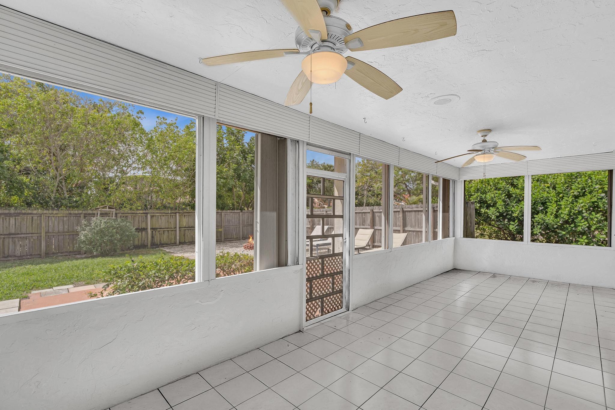 6144 Royal Lytham Drive Boca Raton, FL 33433 - Photo 28 of 70 a view of room with window and a ceiling fan