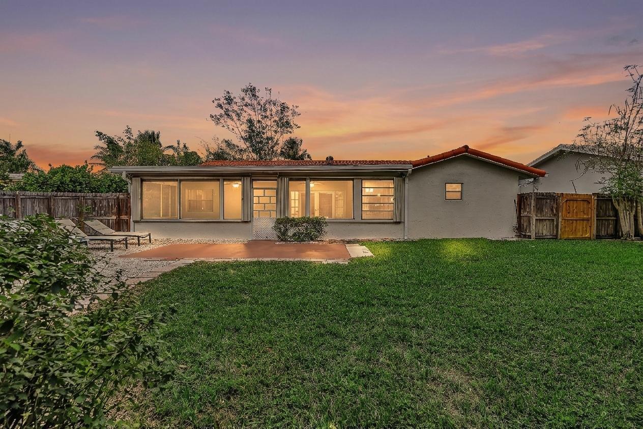 6144 Royal Lytham Drive Boca Raton, FL 33433 - Photo 41 of 70 a front view of house with yard and green space