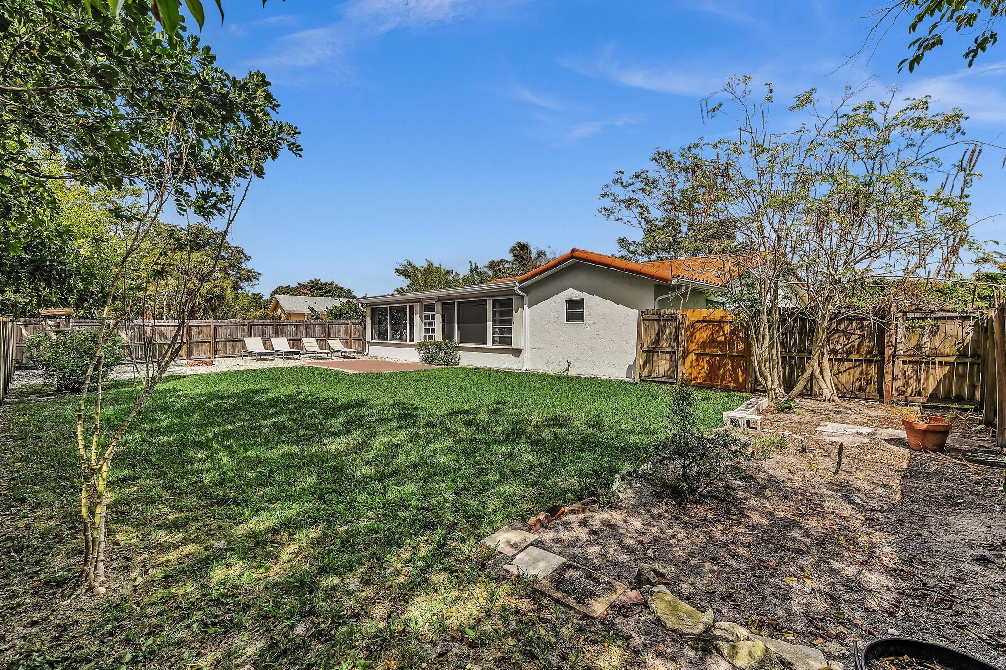 6144 Royal Lytham Drive Boca Raton, FL 33433 - Photo 42 of 70 a view of a house with a yard