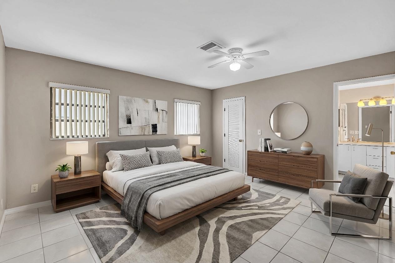 6144 Royal Lytham Drive Boca Raton, FL 33433 - Photo 45 of 70 a bedroom with a bed mirror and window