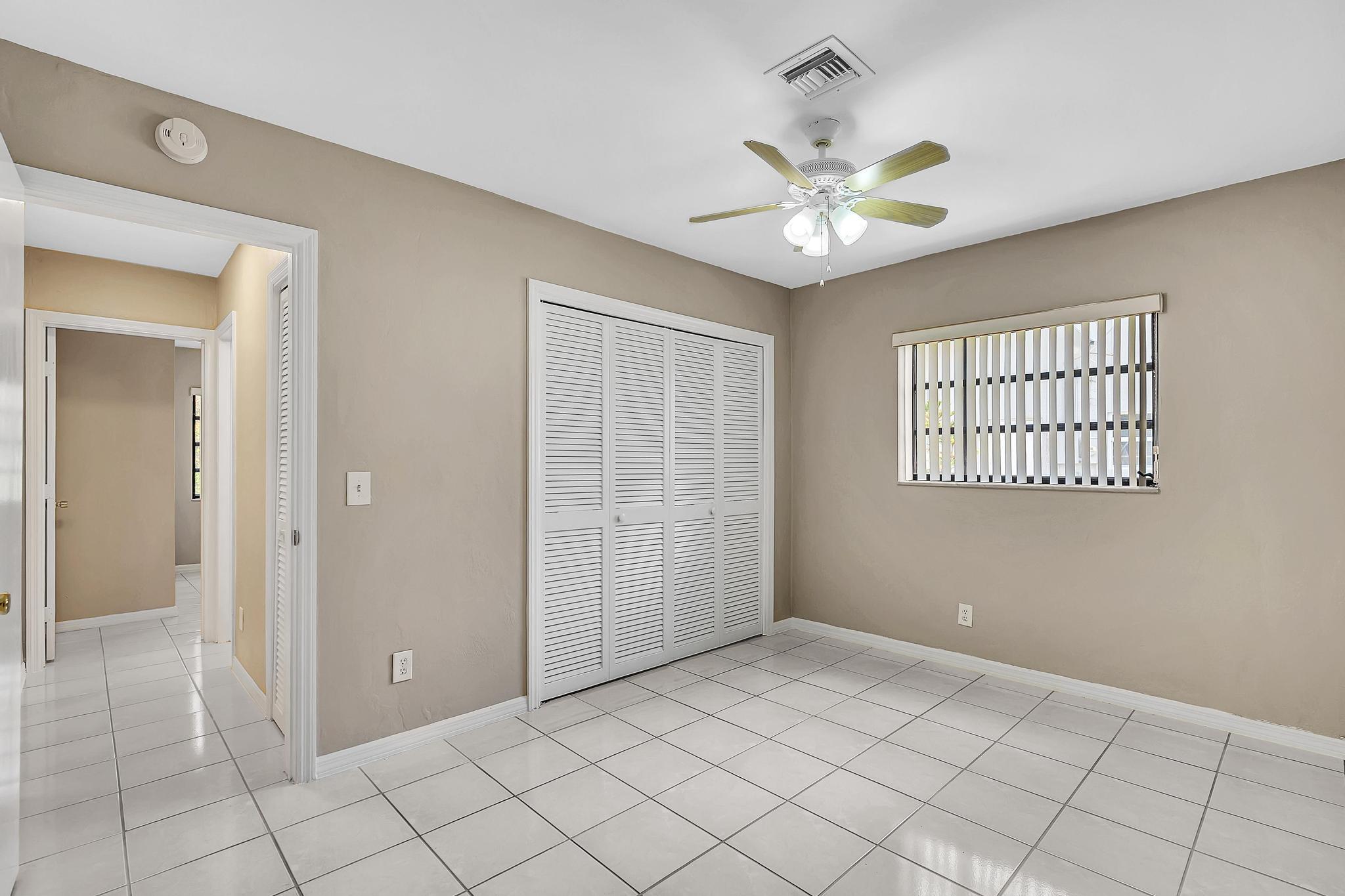6144 Royal Lytham Drive Boca Raton, FL 33433 - Photo 56 of 70 a view of an empty room with a window