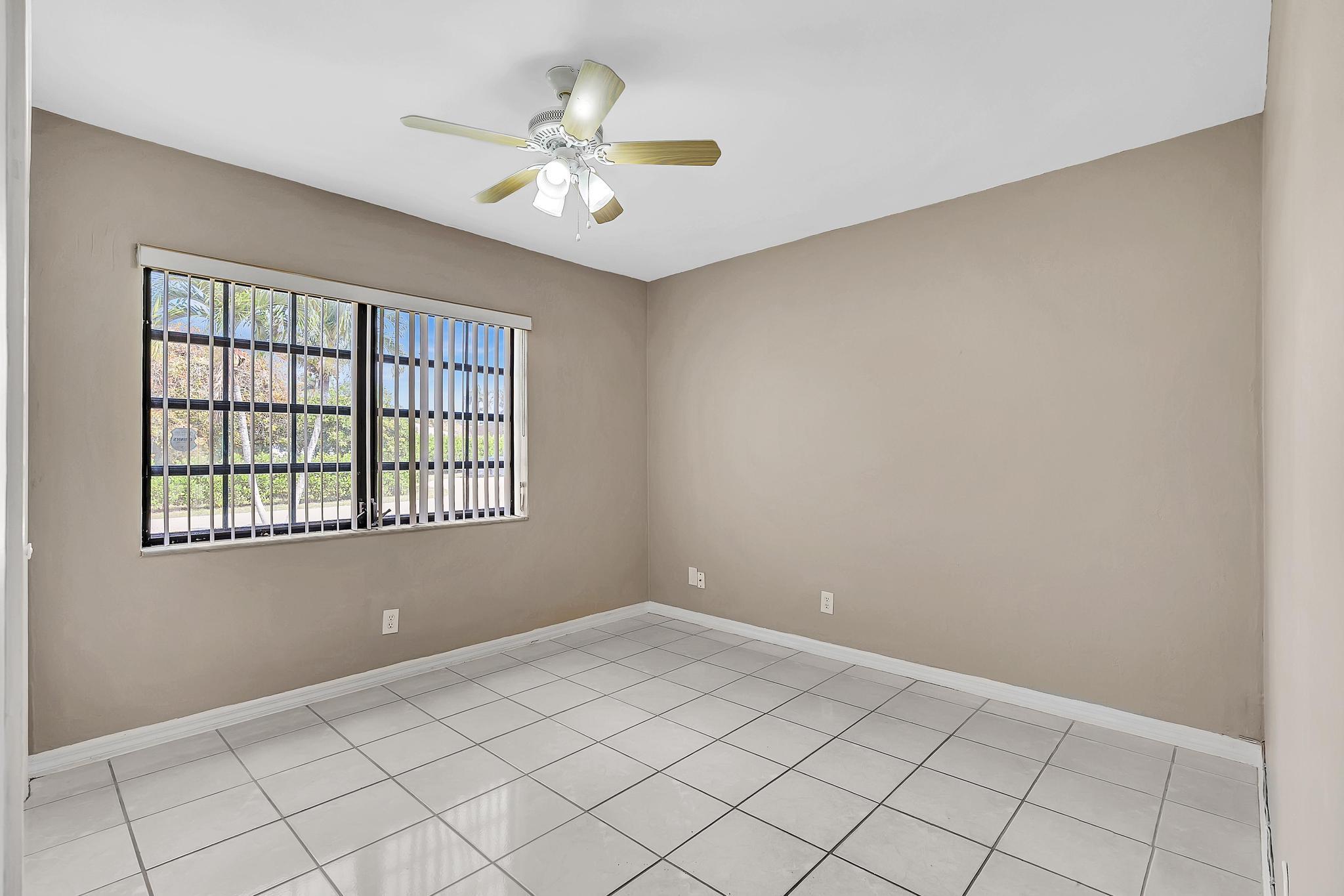 6144 Royal Lytham Drive Boca Raton, FL 33433 - Photo 59 of 70 a view of an empty room with windows