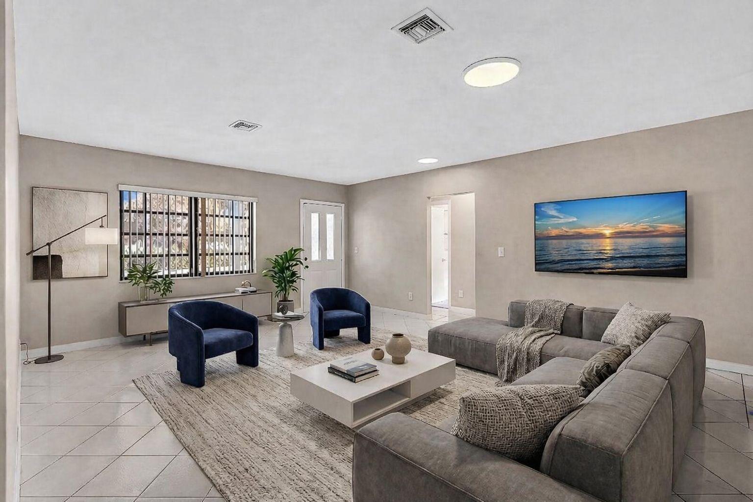 6144 Royal Lytham Drive Boca Raton, FL 33433 - Photo 7 of 70 a living room with couches a coffee table and a flat screen tv