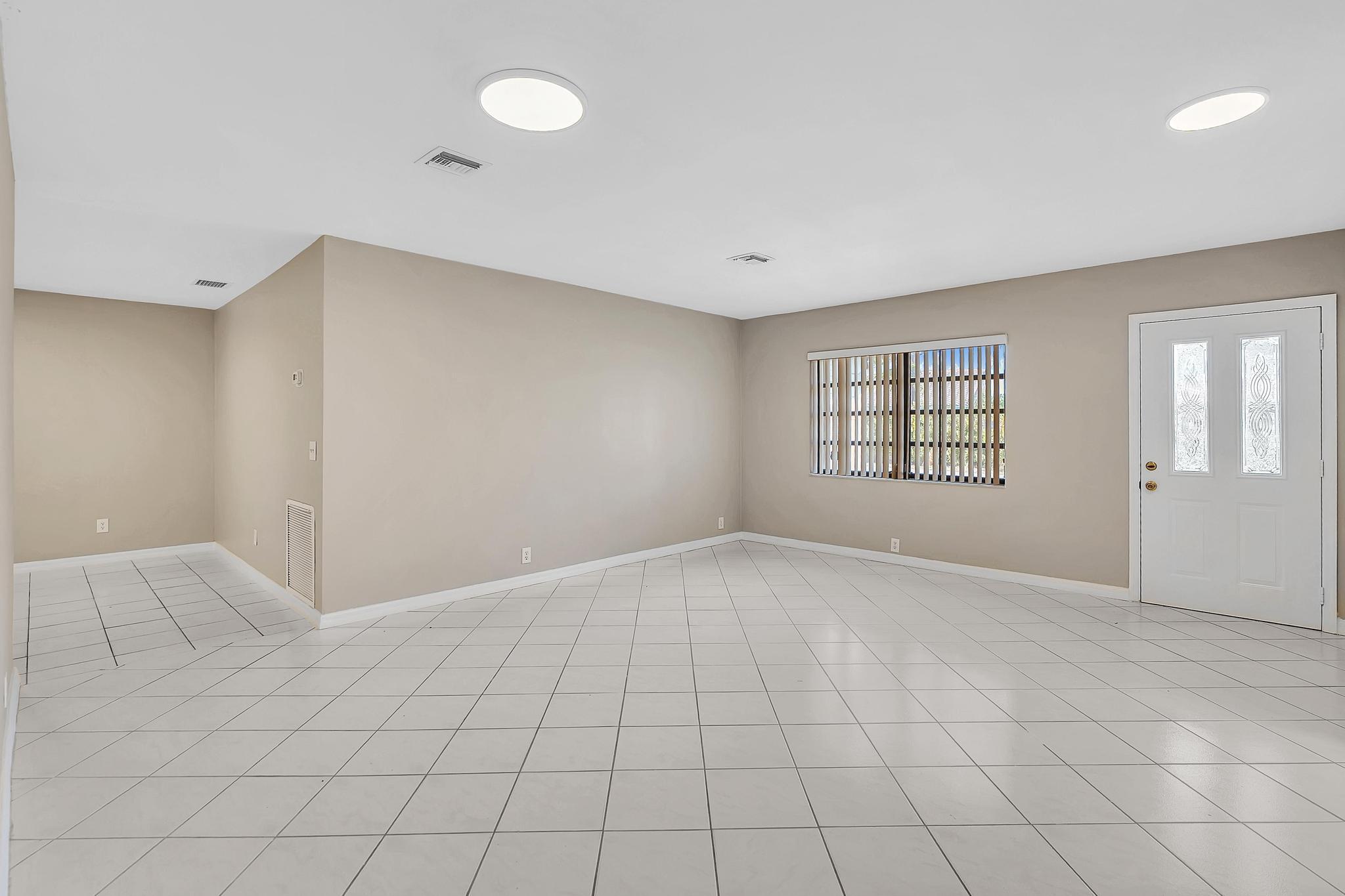 6144 Royal Lytham Drive Boca Raton, FL 33433 - Photo 9 of 70 a view of an empty room with a window