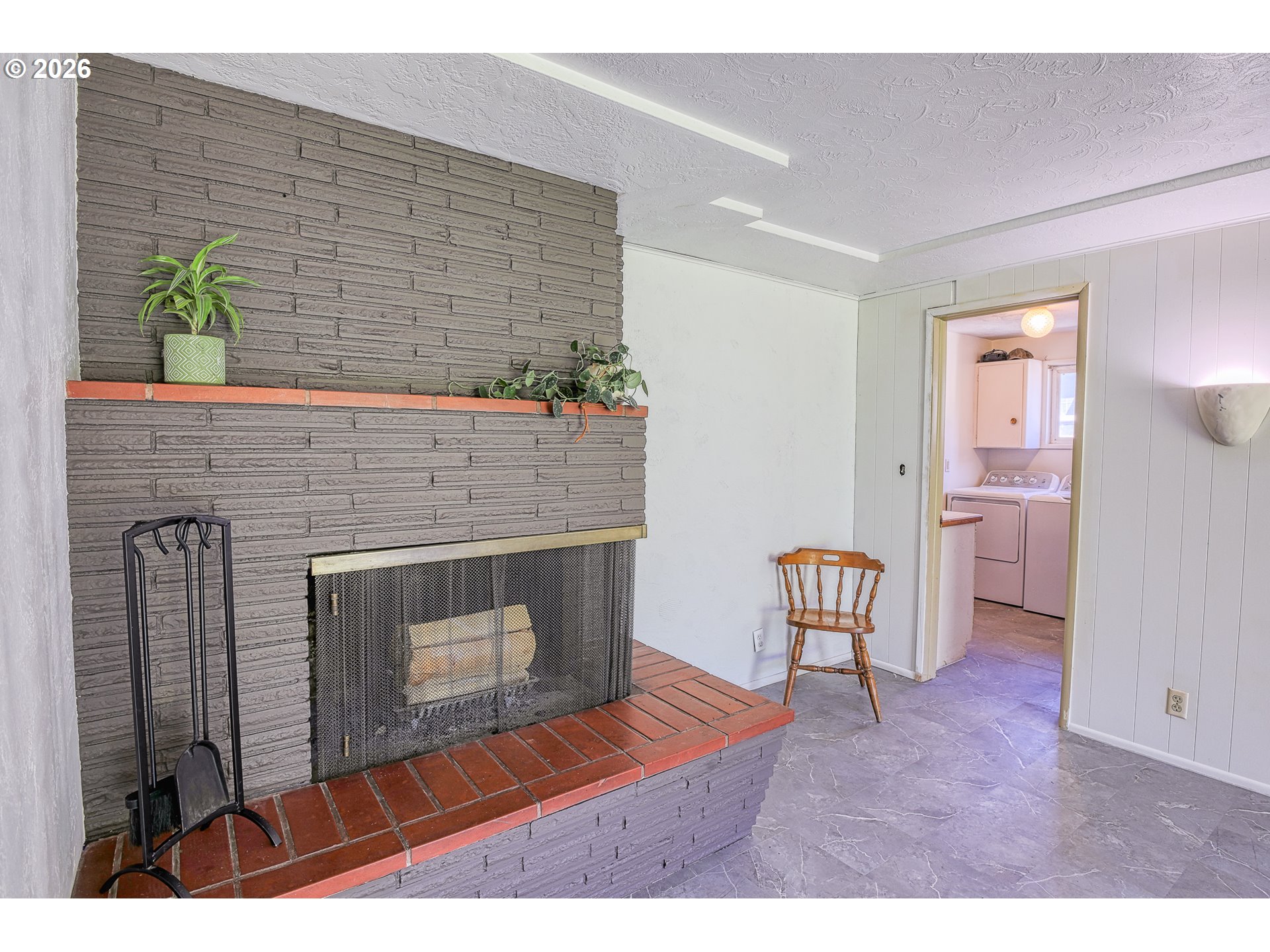 7077 Main Street Springfield, OR 97478 - Photo 10 of 34 a living room with furniture and a fireplace