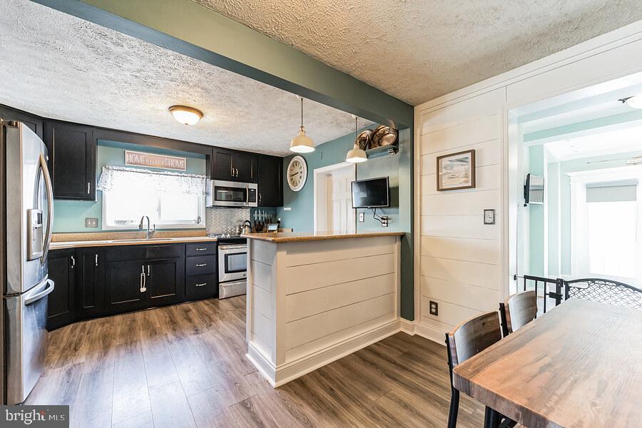 8110 Highpoint Road Clearwater Beach, MD 21226 - Photo 6 of 57 New Flooring, Shiplap Walls & Island