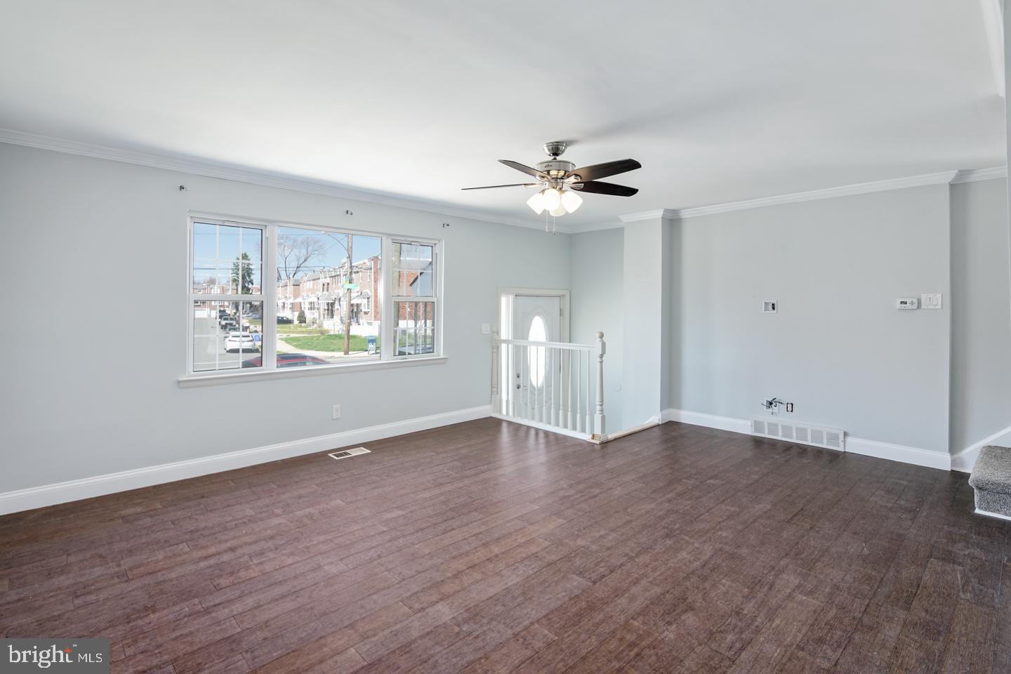 12519 Medford Road Philadelphia, PA 19154 - Photo 12 of 20 a view of an empty room with a window and wooden floor