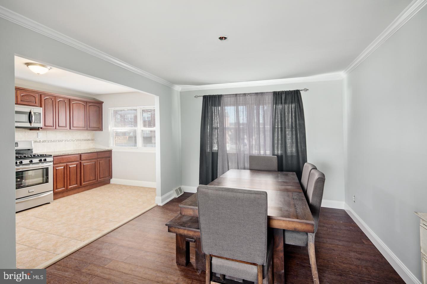 12519 Medford Road Philadelphia, PA 19154 - Photo 9 of 20 a view of a dining room with furniture and wooden floor