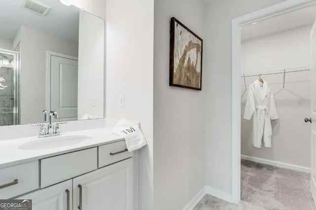 a bathroom with a sink and a mirror
