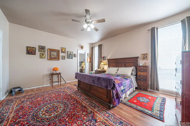 a bed room with a bed and a chandelier