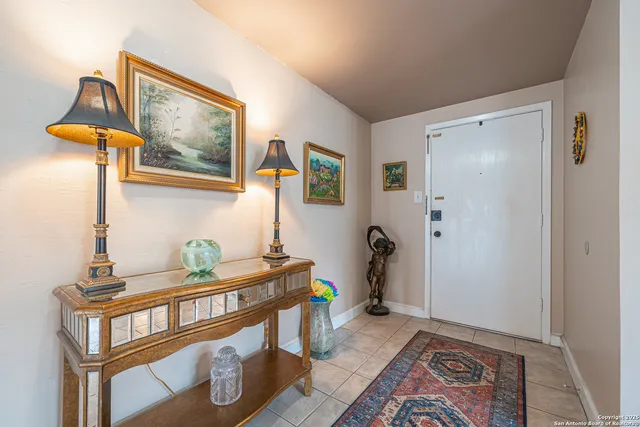 a kitchen with a sink and a mirror