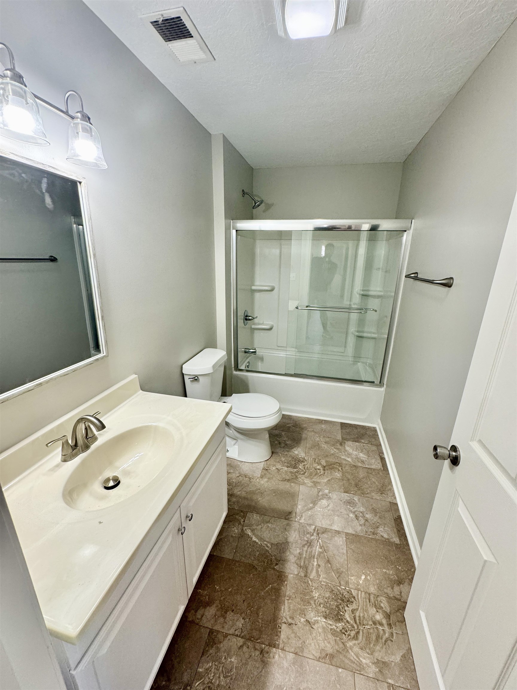 4638 Asbury Glimp Road Ripley, TN 38063 - Photo 13 of 16 a bathroom with a sink a toilet and shower