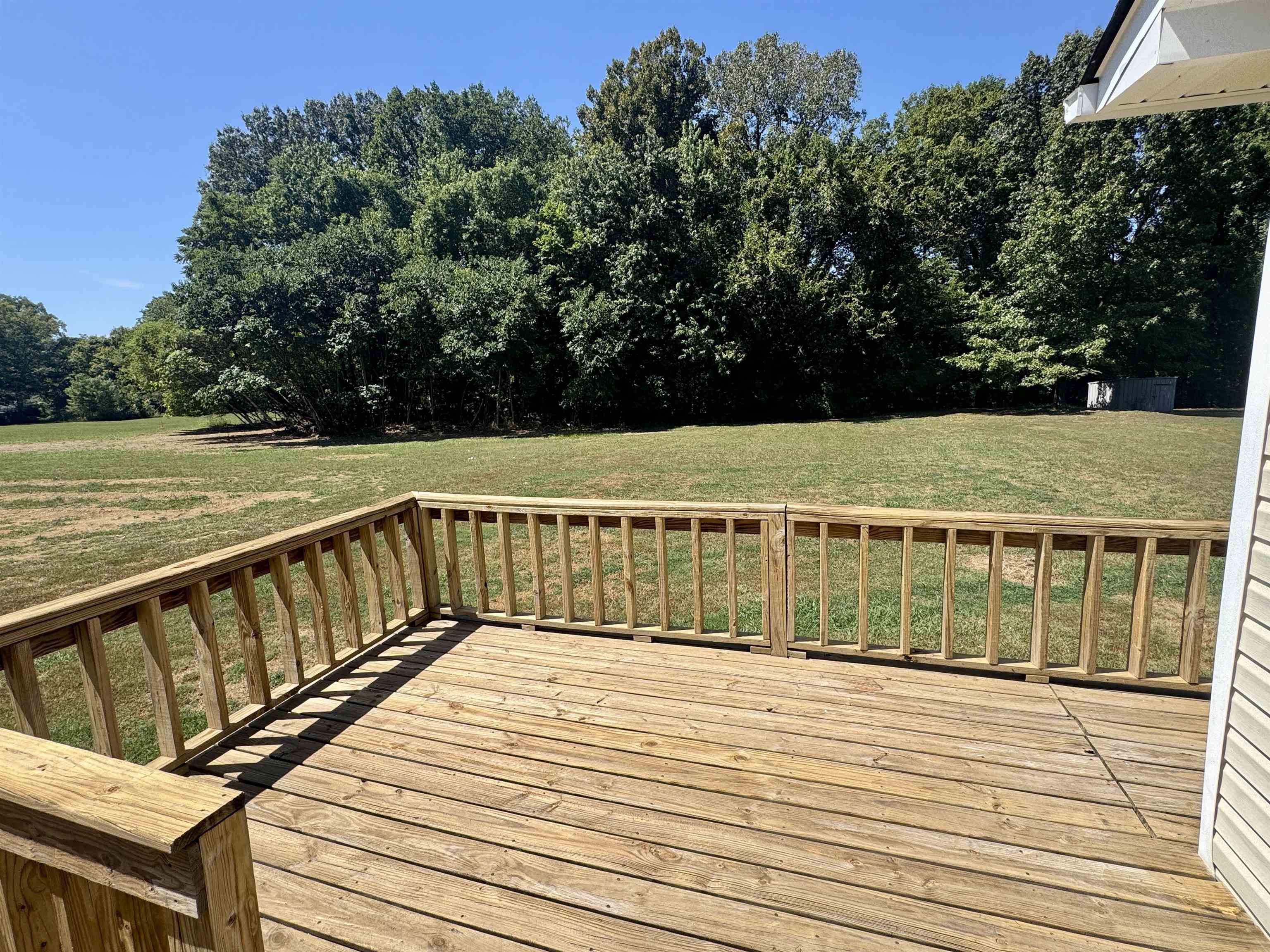 4638 Asbury Glimp Road Ripley, TN 38063 - Photo 4 of 16 a view of a balcony with wooden floor and fence