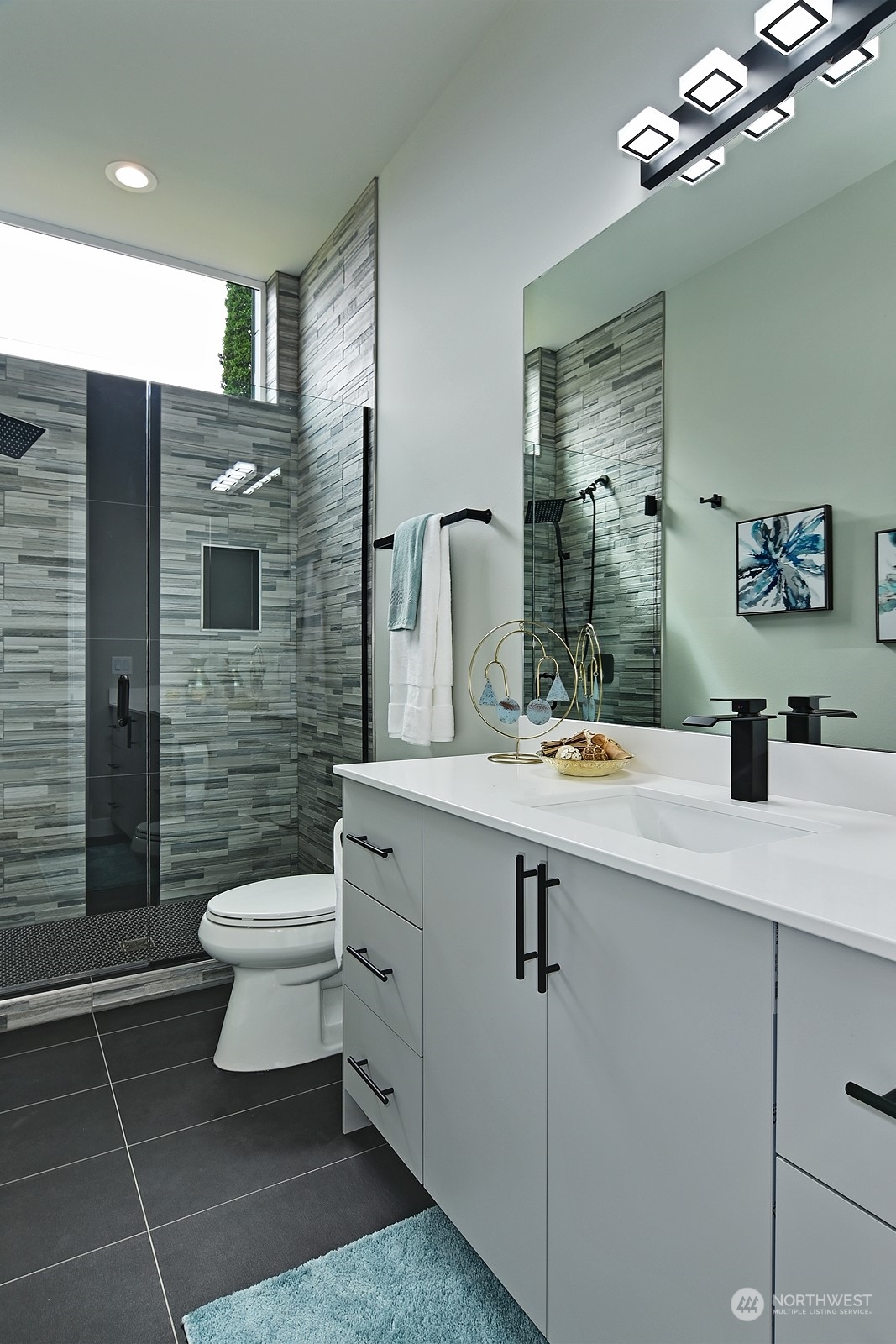 2707 South Ferdinand Street Seattle, WA 98108 - Photo 11 of 38 a spacious bathroom with a toilet sink and mirror