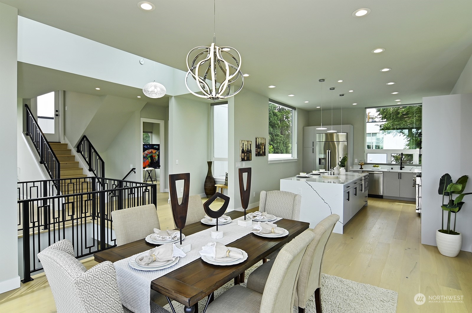 2707 South Ferdinand Street Seattle, WA 98108 - Photo 18 of 38 a view of a dining room and livingroom with furniture wooden floor a chandelier